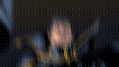 Blurry Man In Cape With Letter O GIF