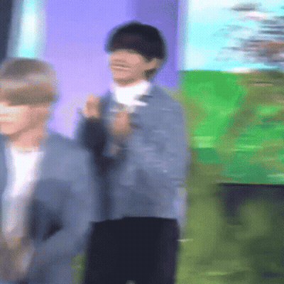 Blurry Man In Front Of Green Field GIF