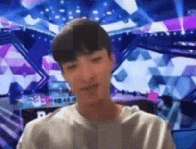Blurry Man In Front Of Stage With Letter R GIF
