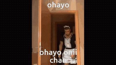 Blurry Man In Green Sweater In Store GIF