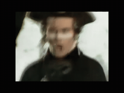 Blurry Man In Hat And Black Coat GIF