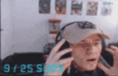 Blurry Man In Headphones And Hat At 9:25 GIF