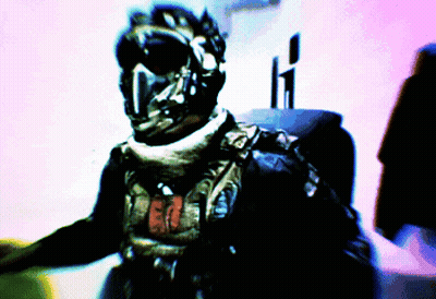 Blurry Man in Helmet With Letter T