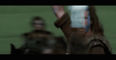 Blurry Man In Leather Jacket Holding Sword GIF