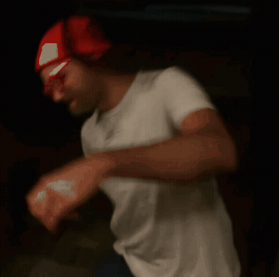 Blurry Man In Red Hat And White Shirt GIF