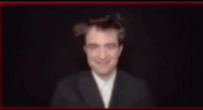 Blurry Man In Suit And Bow Tie Smiling GIF