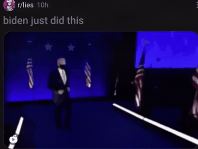 Blurry Man In Suit Dancing On Stage With Flags GIF