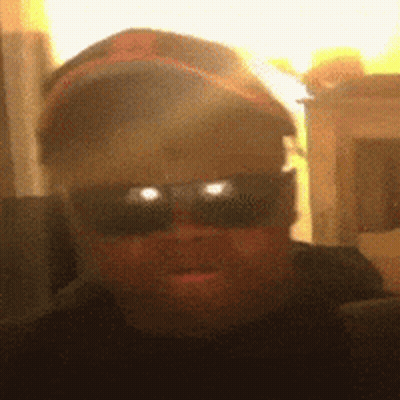 Blurry Man In Sunglasses And Baseball Cap GIF