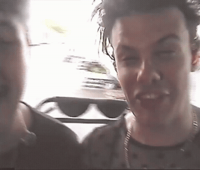 Blurry Man In Sunglasses And Black Shirt GIF
