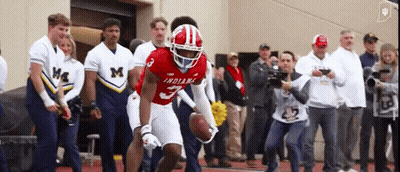 Blurry Man In White Shirt And Hat GIF