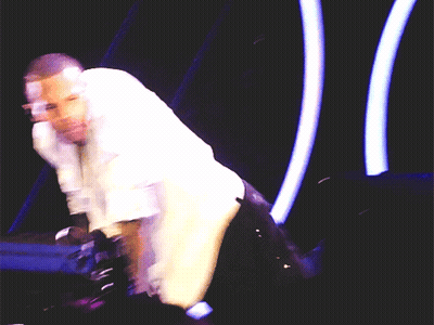 Blurry Man In White Shirt On Stage GIF