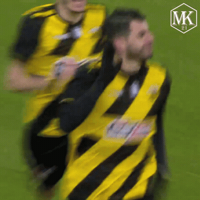 Blurry Man In Yellow And Black Striped Shirt GIF