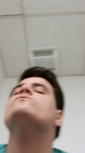 Blurry Man Looking Up At Ceiling GIF