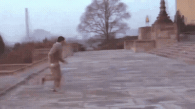 Blurry Man Running Down Staircase GIF