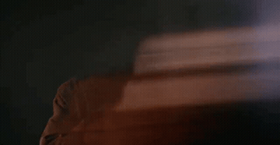 Blurry Man's Face In Dark Room GIF