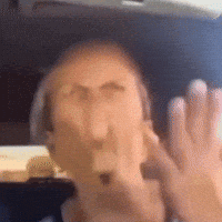 Blurry Man's Face With Hands Behind GIF
