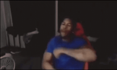 Blurry Man Sitting In Dark Room GIF