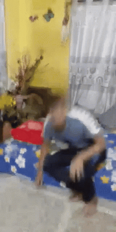 Blurry Man Sitting On Bed GIF