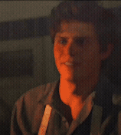 Blurry Man Standing In Crowd GIF