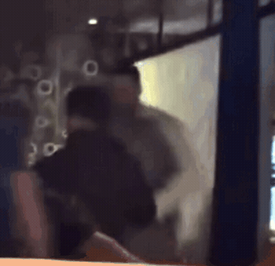 Blurry Man Standing In Front Of Window GIF