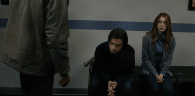 Blurry Man Standing Next To Woman GIF