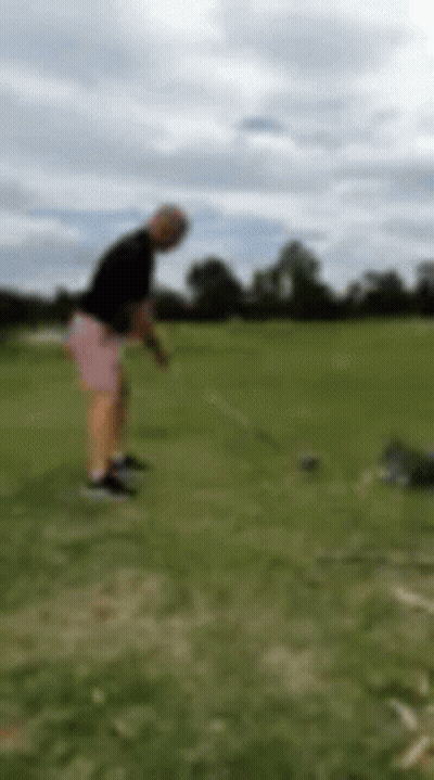 Blurry Man Swinging Golf Club GIF