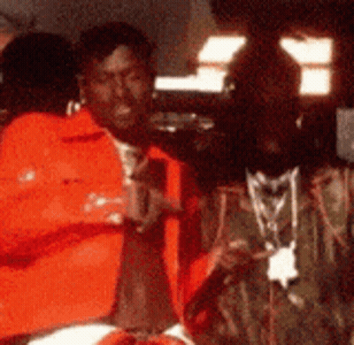 Blurry Man Wearing Necklace GIF