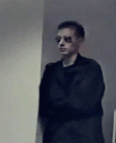 Blurry Man Wearing Sunglasses And Black Shirt GIF