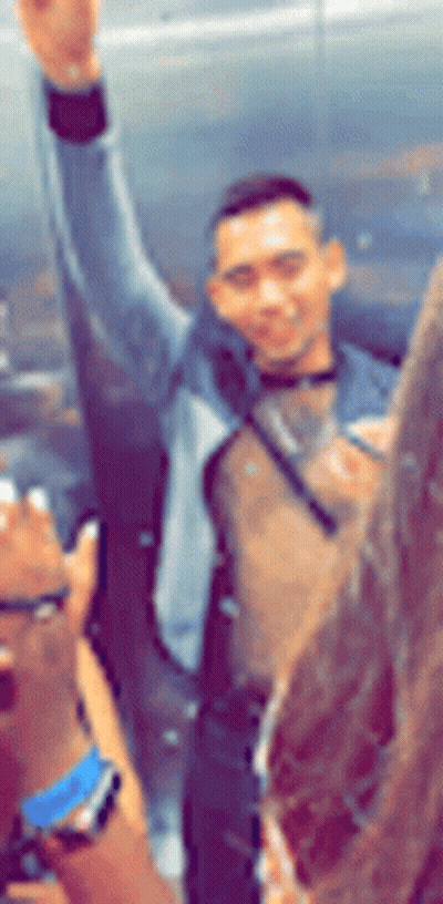 Blurry Man With Arm In Air GIF