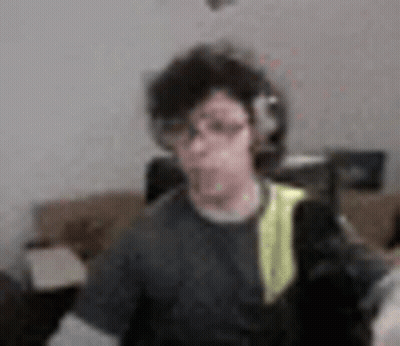 Blurry Man With Headphones And Backpack GIF