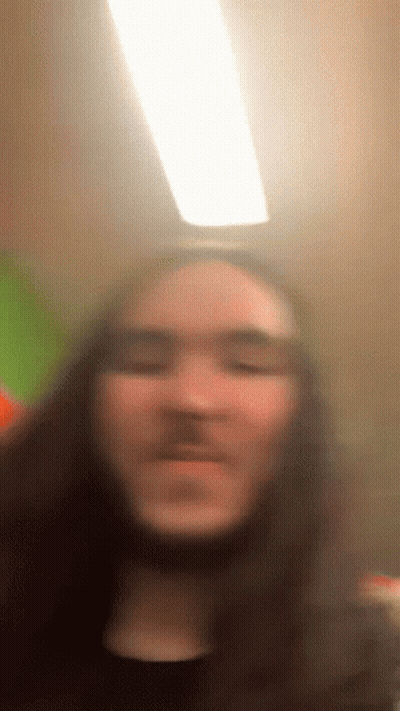 Blurry Man With Long Hair GIF