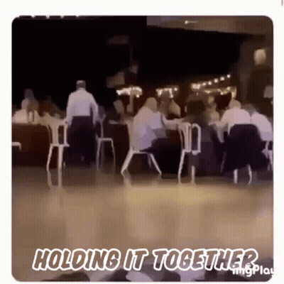 Blurry People Sitting At Tables Holding It Together GIF