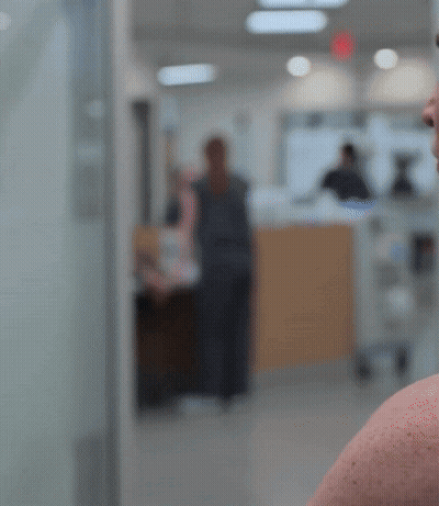 Blurry People Walking In Hospital GIF