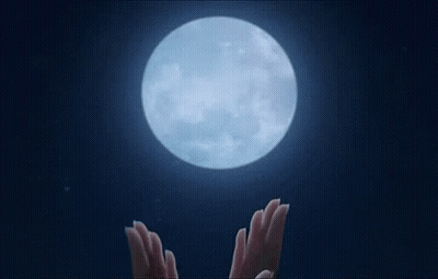 Blurry Person Face And Hands With Green Lights GIF