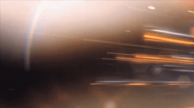 Blurry Person Face With Rainbow Background GIF