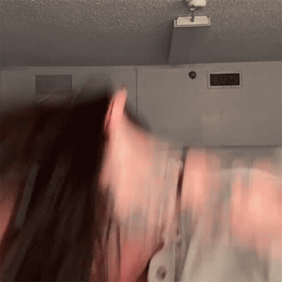 Blurry Person Head In Front Of Ceiling Light GIF