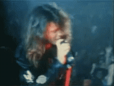 Blurry Person Holding Microphone