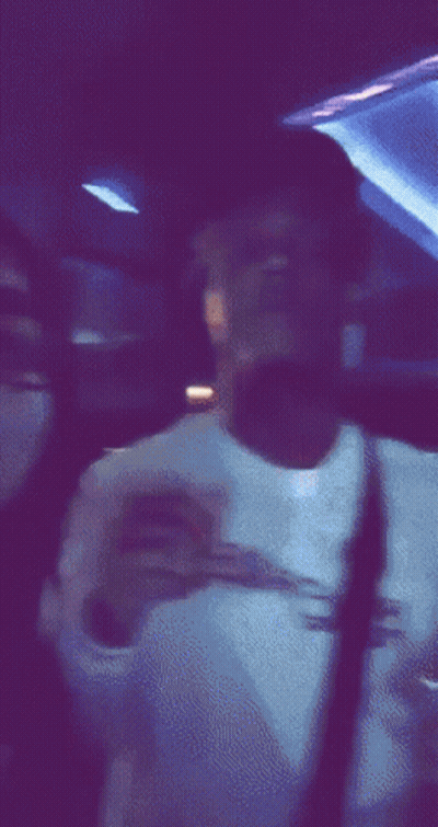 Blurry Person In Dark Room With Purple Lights GIF