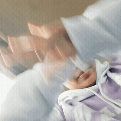 Blurry Person In Purple Hoodie With Letter T GIF