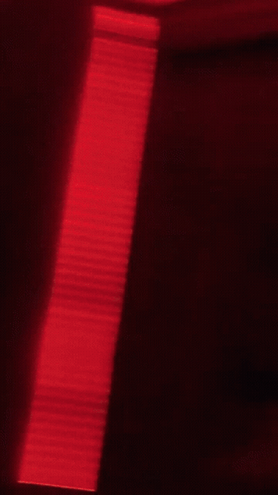 Blurry Person In Red Hat And Headband GIF