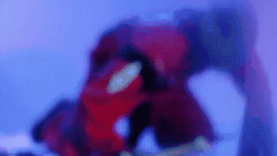 Blurry Person In Red Suit In Purple Room GIF