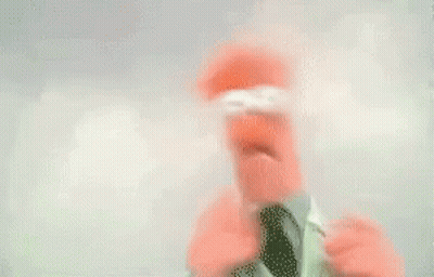 Blurry Person In Santa Hat Holding Bottle GIF