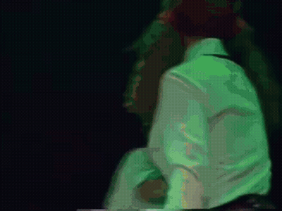 Blurry Person In White Shirt With Letter N GIF