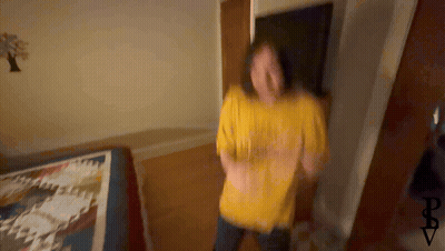Blurry Person In Yellow Shirt Saying I Love You GIF