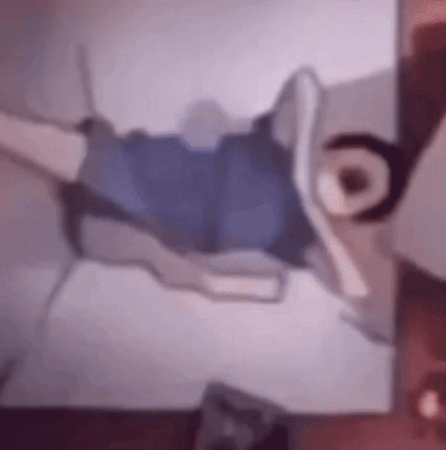 Blurry Person Laying On Bed GIF