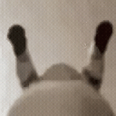 Blurry Person Lying Back Legs Up GIF