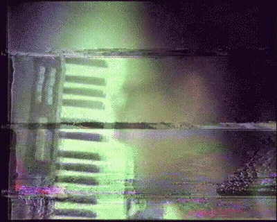 Blurry Person Playing Piano With Green Light GIF
