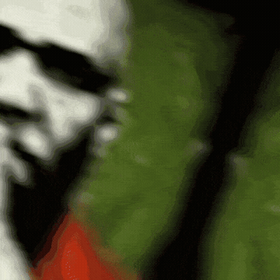 Blurry Person's Face Green And Red Background GIF