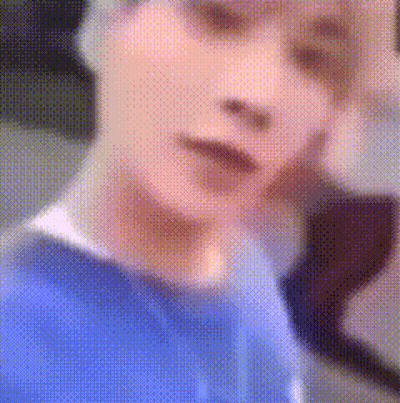 Blurry Person's Face In Blue Shirt GIF