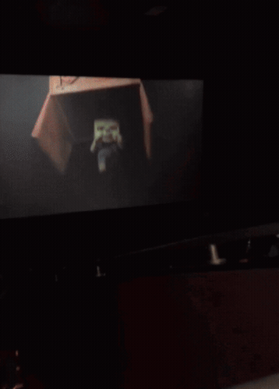 Blurry Person's Face With Yellow Light GIF